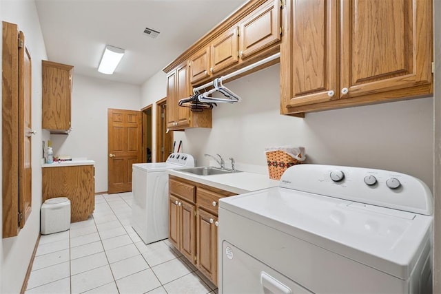 14601 Billy Dr, Edmond, OK 73034 - washroom with cabinet space, washing machine and dryer, and light tile patterned floors