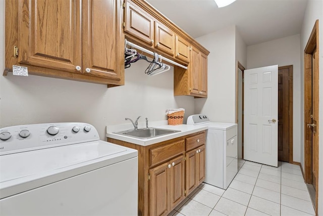 14601 Billy Dr, Edmond, OK 73034 - laundry area with independent washer and dryer, cabinet space, and light tile patterned floors