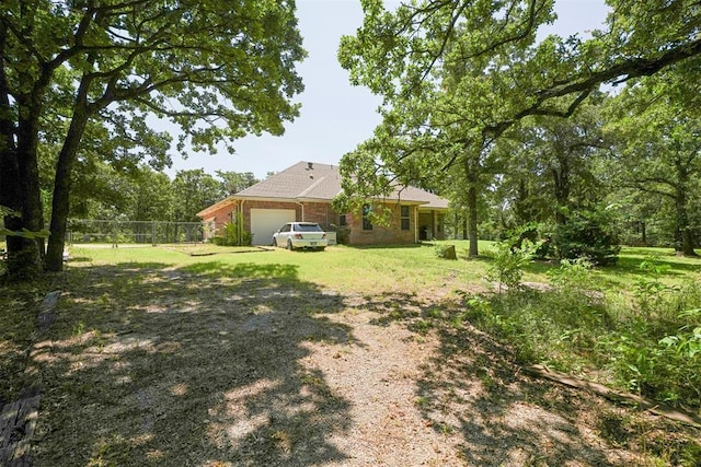 14601 Billy Dr, Edmond, OK 73034 - view of yard with an attached garage