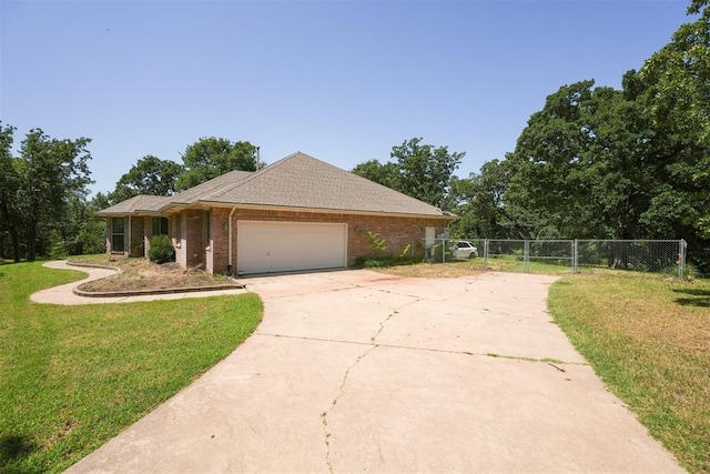 14601 Billy Dr, Edmond, OK 73034 - single story home with driveway, an attached garage, brick siding, and a gate