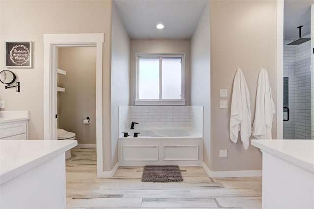 14716 Turkey Hills Rd, Newalla, OK 74857 - full bath with a bath, a shower stall, vanity, and wood finished floors