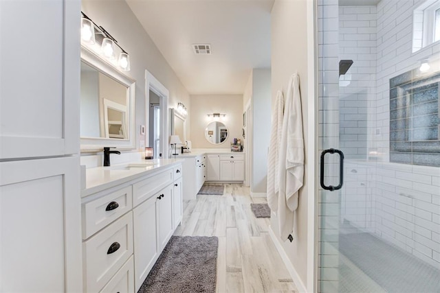 14716 Turkey Hills Rd, Newalla, OK 74857 - full bath featuring a stall shower, vanity, and wood finished floors