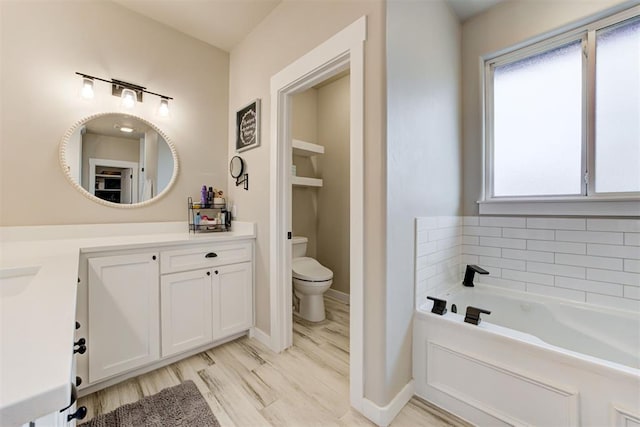 14716 Turkey Hills Rd, Newalla, OK 74857 - full bath featuring vanity, a bath, and wood finished floors