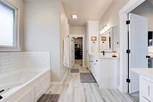 14716 Turkey Hills Rd, Newalla, OK 74857 - full bath featuring vanity, a whirlpool tub, and a spacious closet