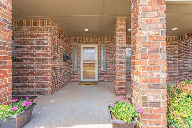 105 Kimberling Dr, Moore, OK 73160 - view of exterior entry featuring brick siding