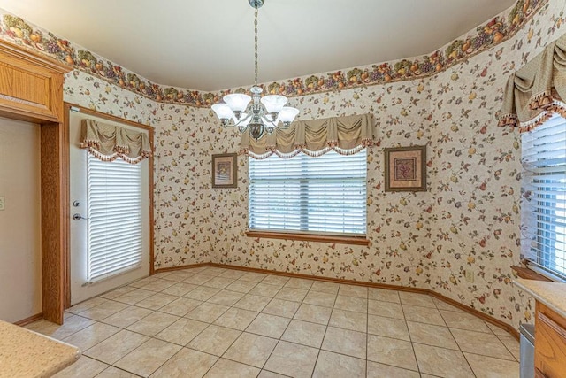 105 Kimberling Dr, Moore, OK 73160 - unfurnished dining area featuring a chandelier, wallpapered walls, and light tile patterned floors