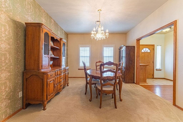 105 Kimberling Dr, Moore, OK 73160 - dining room with a chandelier, wallpapered walls, and light colored carpet
