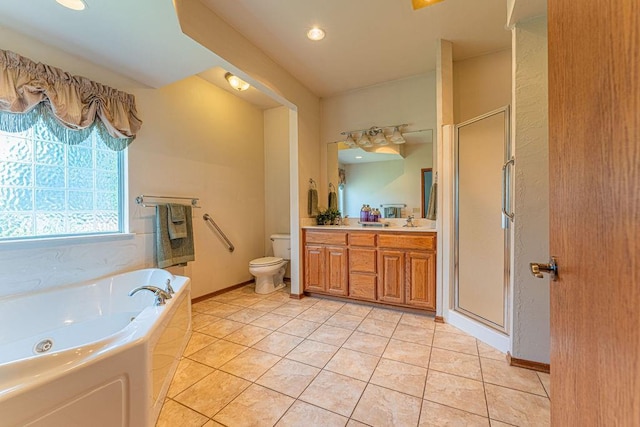 105 Kimberling Dr, Moore, OK 73160 - bathroom with a tub with jets, a stall shower, double vanity, tile patterned floors, and recessed lighting
