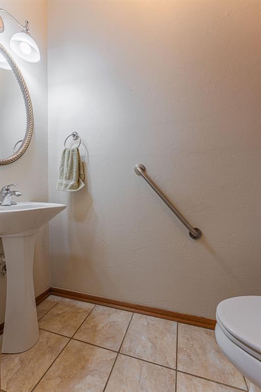 105 Kimberling Dr, Moore, OK 73160 - half bath featuring tile patterned flooring