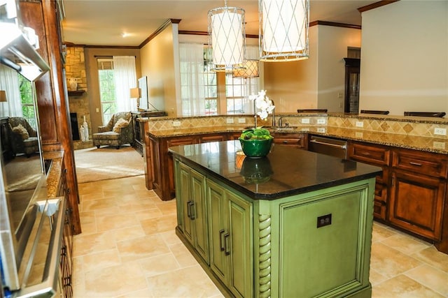 16721 Village Garden Dr, Edmond, OK 73012 - kitchen featuring green cabinetry, ornamental molding, a center island, dishwasher, and open floor plan