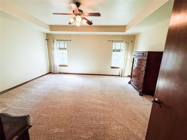 16721 Village Garden Dr, Edmond, OK 73012 - carpeted spare room with plenty of natural light, a ceiling fan, and a raised ceiling