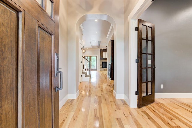 7600 Walk In The Park Dr, Edmond, OK 73034 - entryway featuring arched walkways and light wood-style floors