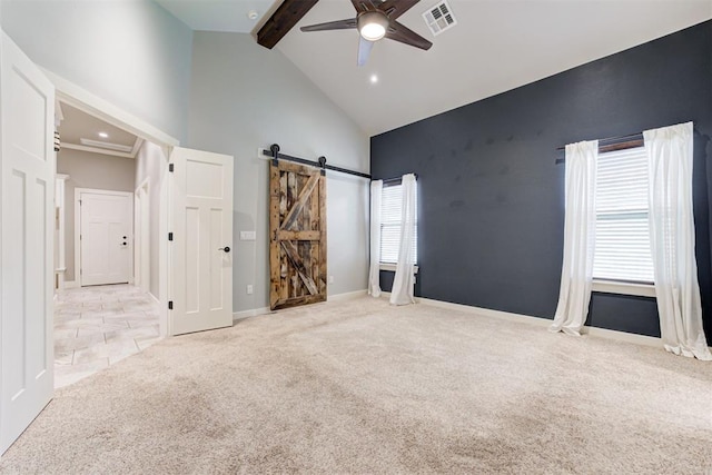 7600 Walk In The Park Dr, Edmond, OK 73034 - unfurnished bedroom featuring a barn door, high vaulted ceiling, carpet flooring, beamed ceiling, and a ceiling fan