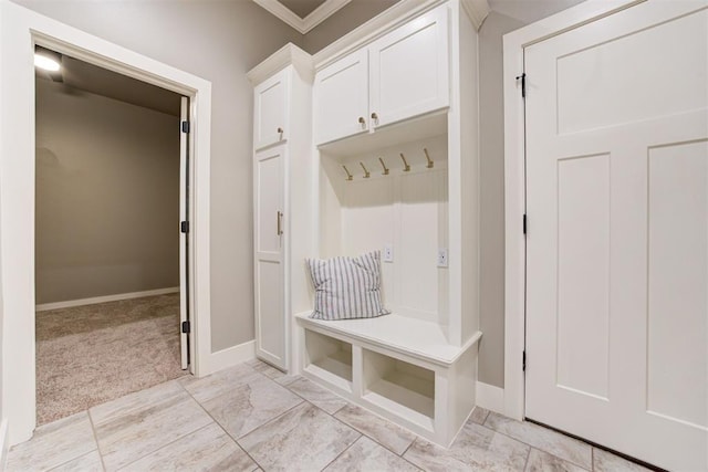 7600 Walk In The Park Dr, Edmond, OK 73034 - mudroom with ornamental molding and light carpet