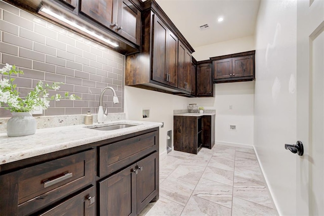 7600 Walk In The Park Dr, Edmond, OK 73034 - laundry room with cabinet space, light marble finish floors, hookup for a washing machine, and recessed lighting