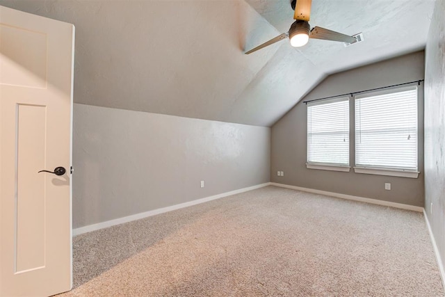 7600 Walk In The Park Dr, Edmond, OK 73034 - additional living space with vaulted ceiling, carpet flooring, and ceiling fan