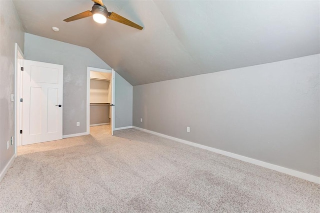7600 Walk In The Park Dr, Edmond, OK 73034 - bonus room featuring a ceiling fan, light colored carpet, and vaulted ceiling