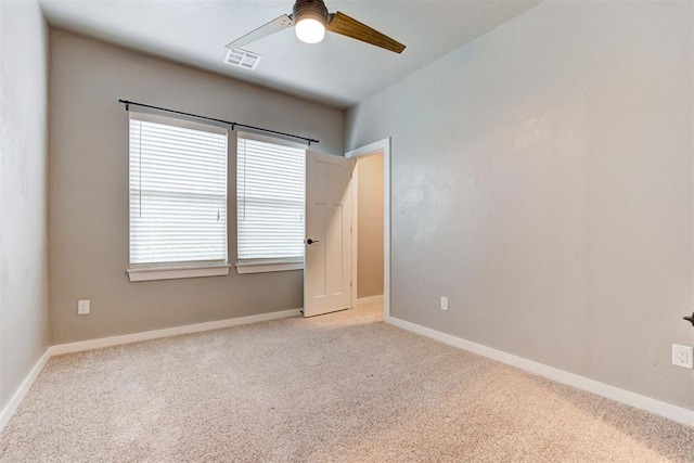 7600 Walk In The Park Dr, Edmond, OK 73034 - empty room with a ceiling fan and carpet floors