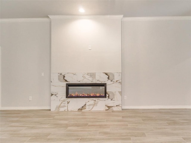 9070 Oak Tree Cir, Edmond, OK 73025 - unfurnished living room with a fireplace, wood finished floors, and crown molding