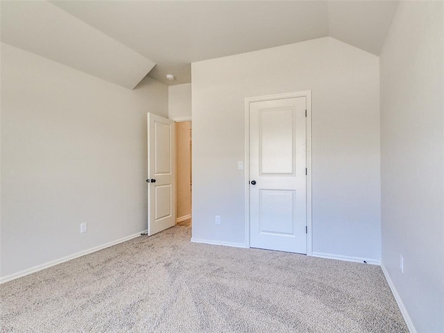 9070 Oak Tree Cir, Edmond, OK 73025 - unfurnished bedroom featuring carpet flooring and lofted ceiling