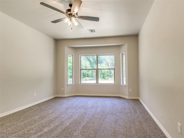 9070 Oak Tree Cir, Edmond, OK 73025 - unfurnished room featuring carpet flooring and ceiling fan