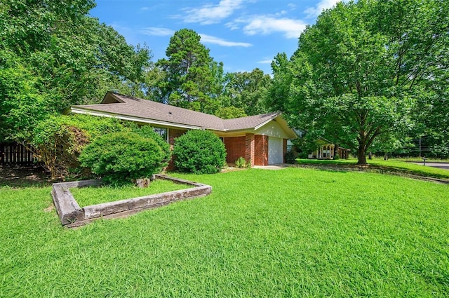 1001 Norris Ave, Broken Bow, OK 74728 - view of front of property with a garage, a front lawn, and brick siding