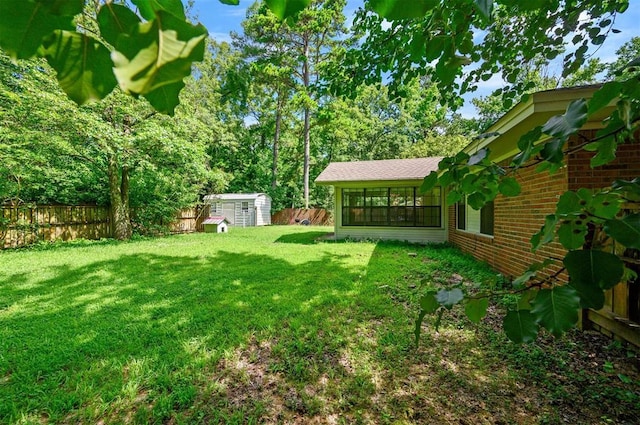 1001 Norris Ave, Broken Bow, OK 74728 - fenced backyard with a storage unit