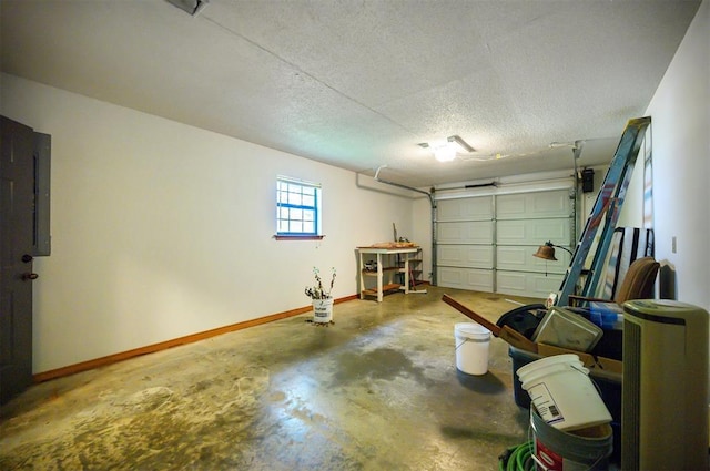 1001 Norris Ave, Broken Bow, OK 74728 - garage featuring baseboards