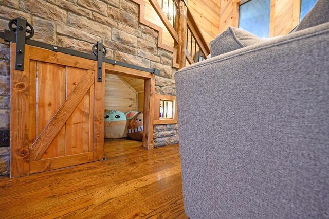 25 Paint Horse Cir, Broken Bow, OK 74728 - hall featuring wood finished floors and a barn door