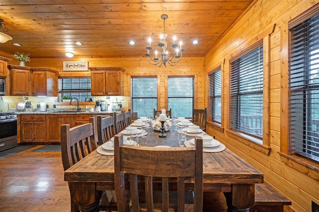25 Paint Horse Cir, Broken Bow, OK 74728 - dining space with wood ceiling, a chandelier, wooden walls, dark wood-style floors, and recessed lighting