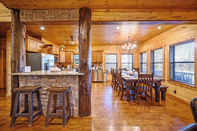 25 Paint Horse Cir, Broken Bow, OK 74728 - kitchen with appliances with stainless steel finishes, wood ceiling, light wood-style floors, a chandelier, and a peninsula