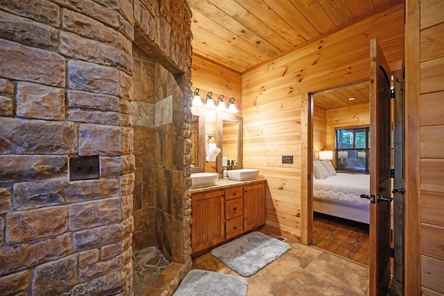 25 Paint Horse Cir, Broken Bow, OK 74728 - ensuite bathroom featuring double vanity, wood ceiling, and wood walls