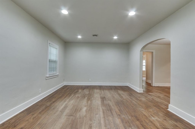 2524 NW 15th St, Oklahoma City, OK 73107 - empty room with arched walkways, healthy amount of natural light, recessed lighting, and dark wood finished floors