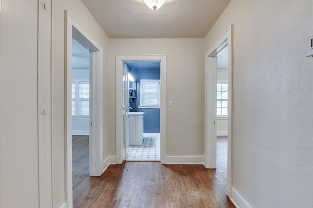 2524 NW 15th St, Oklahoma City, OK 73107 - hallway featuring wood finished floors and plenty of natural light