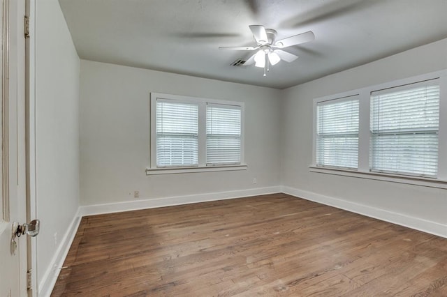 2524 NW 15th St, Oklahoma City, OK 73107 - spare room featuring healthy amount of natural light, wood finished floors, and a ceiling fan