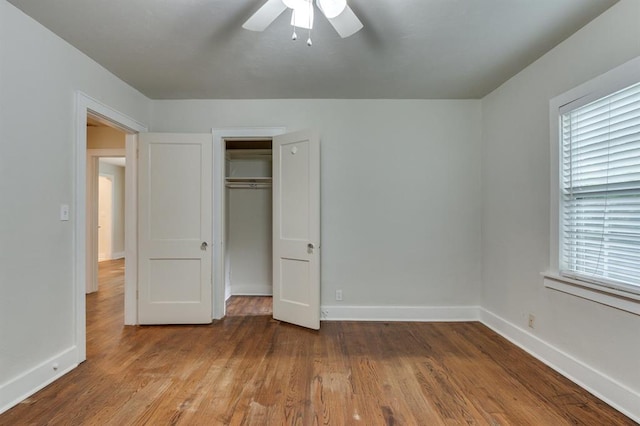 2524 NW 15th St, Oklahoma City, OK 73107 - unfurnished bedroom with multiple windows, wood finished floors, a closet, and ceiling fan