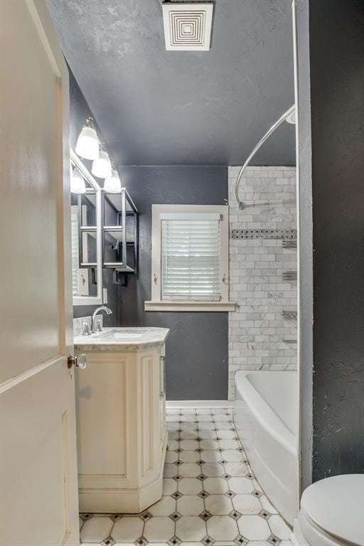 2524 NW 15th St, Oklahoma City, OK 73107 - full bath with vanity, tub / shower combination, and tile patterned floors