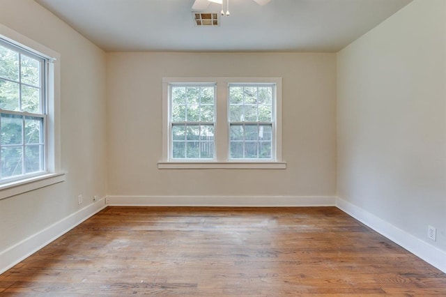 2524 NW 15th St, Oklahoma City, OK 73107 - spare room with plenty of natural light, wood finished floors, and a ceiling fan