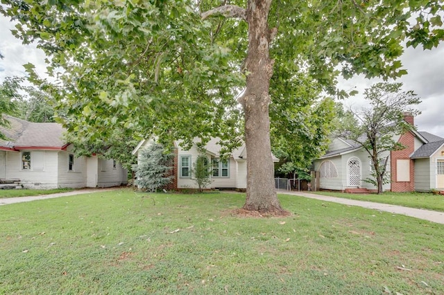 2524 NW 15th St, Oklahoma City, OK 73107 - obstructed view of property featuring a front yard