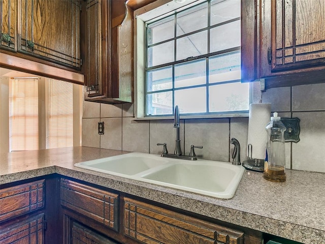 14601 Prairie Ln, Oklahoma City, OK 73165 - kitchen featuring dark brown cabinets and backsplash