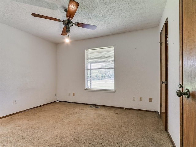 14601 Prairie Ln, Oklahoma City, OK 73165 - unfurnished room with carpet flooring, a textured ceiling, and ceiling fan