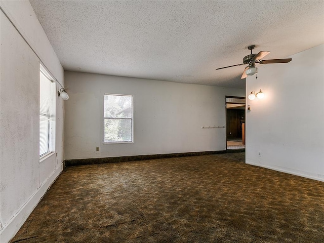 14601 Prairie Ln, Oklahoma City, OK 73165 - empty room with carpet, a textured ceiling, and ceiling fan