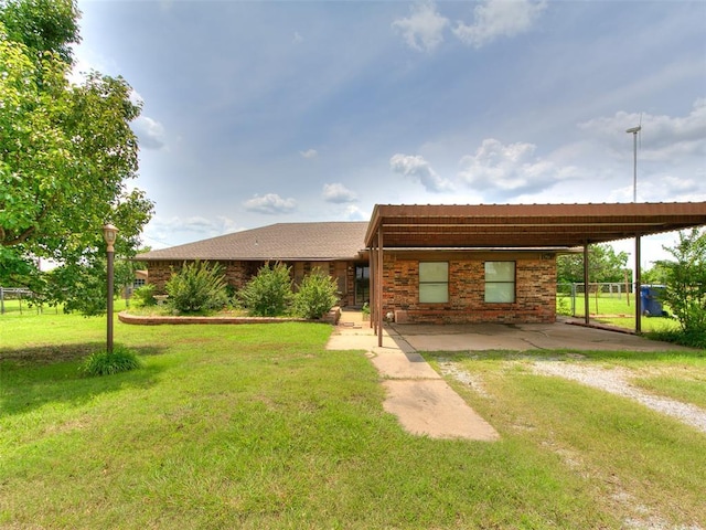 14601 Prairie Ln, Oklahoma City, OK 73165 - ranch-style house with driveway and a carport