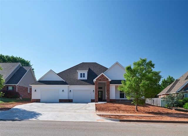 408 Nantucket Blvd, Norman, OK 73071 - view of front facade featuring concrete driveway, a garage, and brick siding