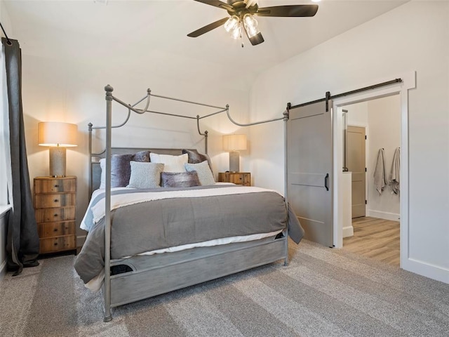 408 Nantucket Blvd, Norman, OK 73071 - bedroom featuring a barn door, carpet floors, and ceiling fan