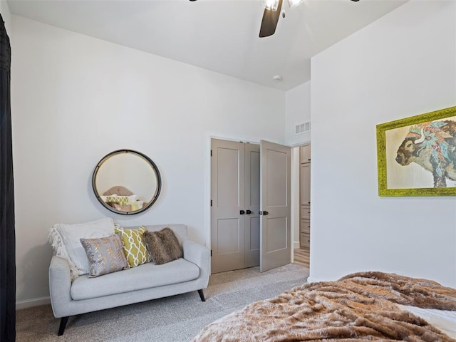408 Nantucket Blvd, Norman, OK 73071 - bedroom featuring light carpet, a ceiling fan, and a high ceiling