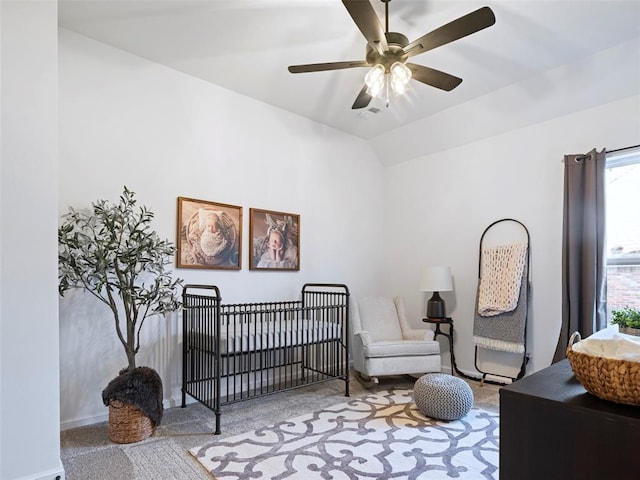 408 Nantucket Blvd, Norman, OK 73071 - carpeted bedroom with lofted ceiling, a nursery area, and ceiling fan