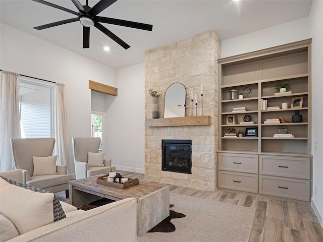408 Nantucket Blvd, Norman, OK 73071 - living room with light wood-type flooring, a ceiling fan, a fireplace, and recessed lighting