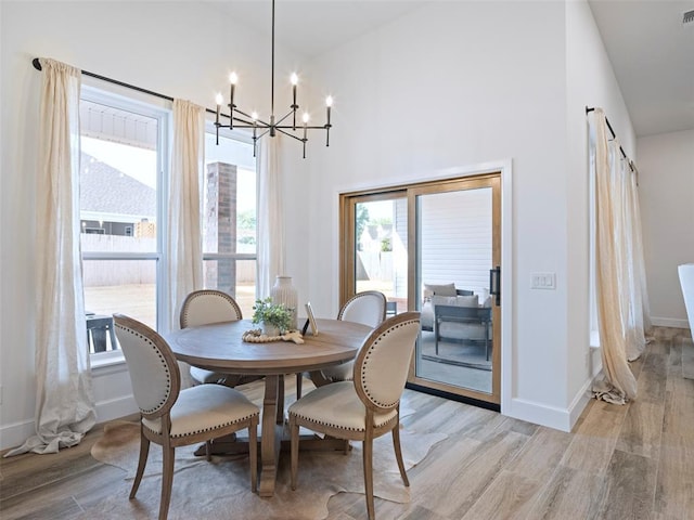 408 Nantucket Blvd, Norman, OK 73071 - dining room featuring a chandelier and light wood-style flooring