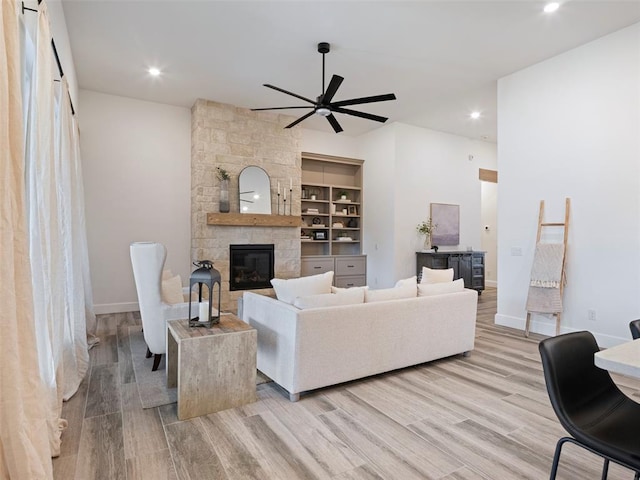 408 Nantucket Blvd, Norman, OK 73071 - living room featuring ceiling fan, a fireplace, light wood finished floors, and recessed lighting